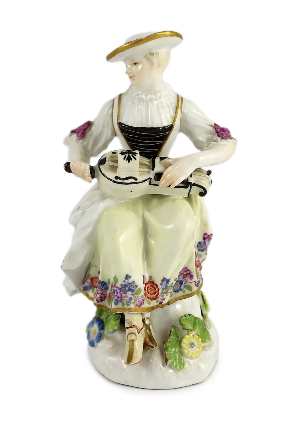 A Meissen porcelain figure of a woman playing the hurdy gurdy, mid 18th century, possibly modelled by J. J. Kandler, 13cm high, restored right foot, Provenance - purchased from Winifred Williams, Eastbourne/London before